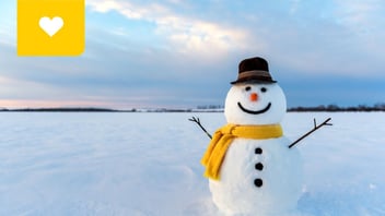 Snowman awaiting winter at their condo/strata